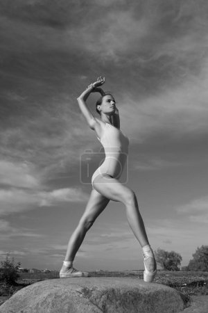 Photo for Young slim beauty woman ballerina in bodysuit - Royalty Free Image