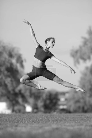 Photo for Young slim beauty woman ballerina in sportswear - Royalty Free Image