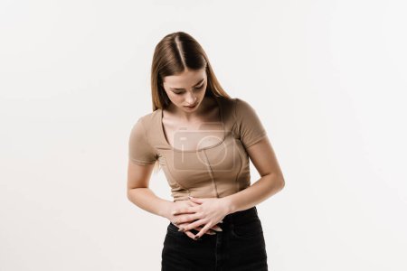 Photo for Appendicitis is inflammation of appendix. Girl feel abdominal pain, fever, vomiting, and loss of appetite because of appendicitis inflammation - Royalty Free Image