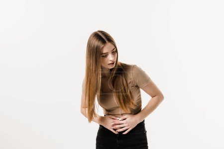 Photo for Stomach pain. Pancreatitis disease of pancreas becomes inflamed. Sick attractive girl hold abdomen because it hurts - Royalty Free Image