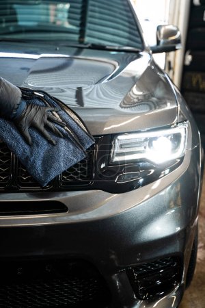 Photo for Car detailing - polishing car using microfiber cloth. Professional car detailing. Microfiber towel for detailing wiping car after washing - Royalty Free Image