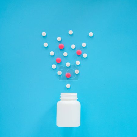 Photo for Pills and tablets on blue background - Royalty Free Image