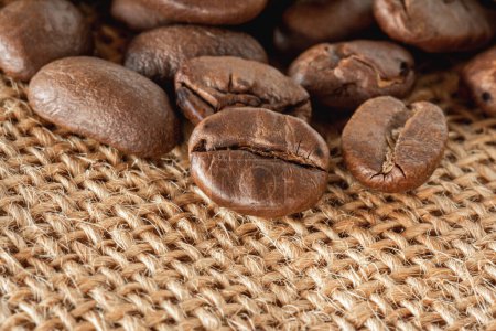 Photo for Coffee beans on burlap sack background - Royalty Free Image