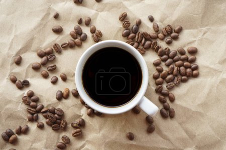 Photo for Cup of coffee and beans on a wooden background - Royalty Free Image