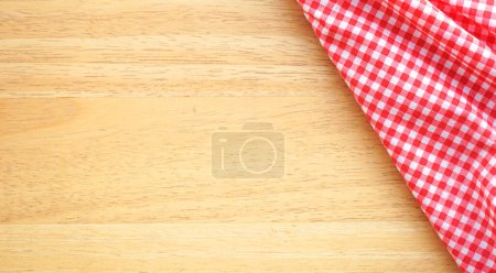 Photo for Wooden table with tablecloth on the kitchen towel - Royalty Free Image