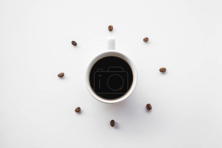 Photo for Coffee cup with beans on white background, top view - Royalty Free Image