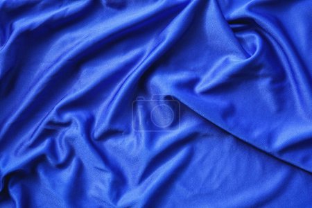 Photo pour Bleu soie tissu texture fond - image libre de droit