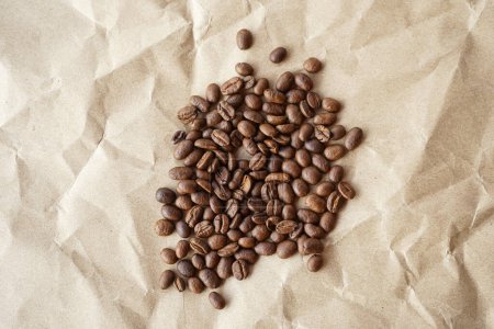 Photo for Coffee beans on paper background - Royalty Free Image