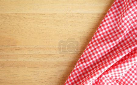 Photo for Kitchen cloth ( napkin ) on wood background with space for copy - Royalty Free Image