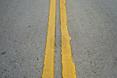 Photo for A yellow line on the road with a line - Royalty Free Image
