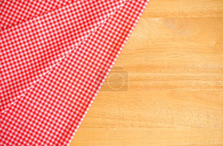 Photo for Red checkered cloth napkin on wood background - Royalty Free Image