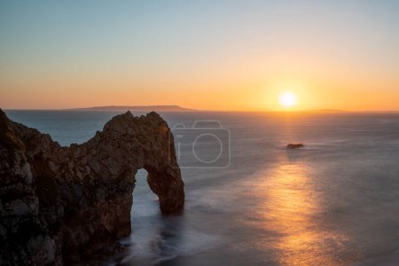 Photo for Long exposure of the calm sea at Durdle Door at dusk - Royalty Free Image