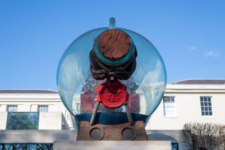 Photo for Greenwich.London.United Kingdom.December 1st 2022.Photo of Nelson's Ship in a bottle on a plinth outside the National Maritime Museum in Greenwich - Royalty Free Image