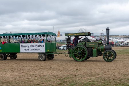 Photo for Tarrant Hinton.Dorset.United Kingdom.August 25th 2022.An Aveling and Porter 1923 Class M traction engine called Souter Johny is giving charity trailer rides at the Great Dorset Steam Fair - Royalty Free Image
