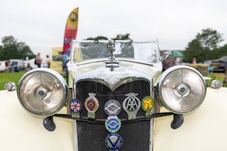Photo for Honiton.Devon.United Kingdom.July 2nd 2021.Close up of the front of a vintage Riley car - Royalty Free Image