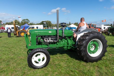 Photo for Drayton.Somerset.United kingdom.August 19th 2023.A modified green Fordson Major is on show at a Yesterdays Farming event - Royalty Free Image