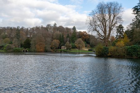 Photo for View of the autumn colours around the lake at Stourhead gardens in Wiltshire - Royalty Free Image