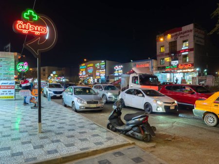 Photo for Baghdad, Iraq - Feb 20, 2023: Landscape Night View of Al-Maghreb Street, which is Known for Having Plenty of Medical Clinics and Pharmacies. - Royalty Free Image