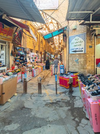 Photo for Baghdad, Iraq - Feb 23, 2023: Portrait View of Al-Saray Bazaar, which was Known Historically as Al-Sarajeen Bazaar, which means in Arabic Saddlemakers' Market for Horse Appliances. - Royalty Free Image