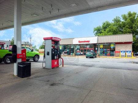 Photo for Whitesboro, New York - July 2, 2023: Close-up View of Speedway Gas Pump in the Foreground and the Speedway Convenience Store in the Background II. - Royalty Free Image