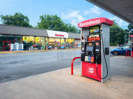 Photo for Whitesboro, New York - June 30, 2023: Close-up View of Speedway Gas Pump in the Foreground and the Speedway Convenience Store in the Background. - Royalty Free Image