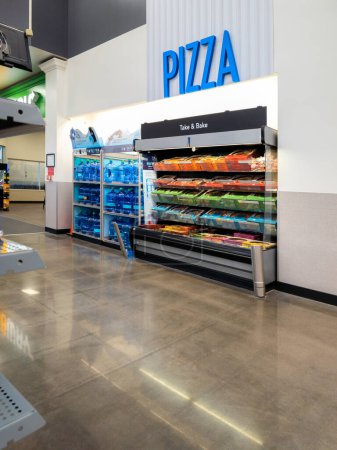 Photo for New Hartford, New York - Aug 6, 2023: Vertical Close-up View of Pizza Section of Walmart Super Center. - Royalty Free Image