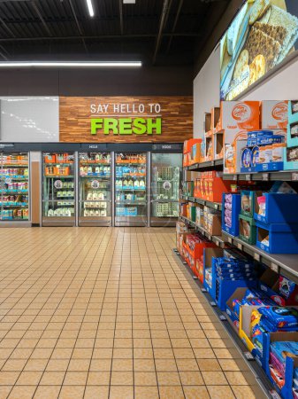 Photo for Yorkville, New York - Aug 26, 2023: Wide Portrait View of Dairy Section and Biscuit Aisles of Aldi Food Market. - Royalty Free Image