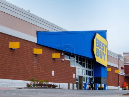 Photo for New Hartford, New York - Nov 11, 2023: Close-up Landscape View of Best Buy Store Entrance with Customer Leaving out. - Royalty Free Image