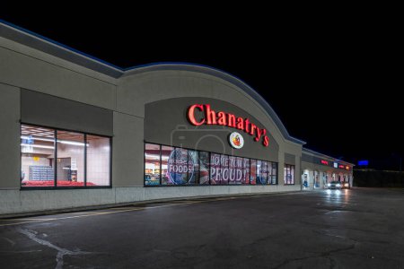 Photo for Utica, New York - Nov 6, 2023: Night View of Chanatry's Hometown Market Storefront. Chanatry's is a Family-owned Business Established in 1912 in Utica. - Royalty Free Image
