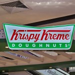 BANGKOK, THAILAND - AUGUST 14, 2023: Krispy Kreme Doughnuts Sign. Krispy Kreme is an American multinational doughnut company that was founded July 13, 1937.