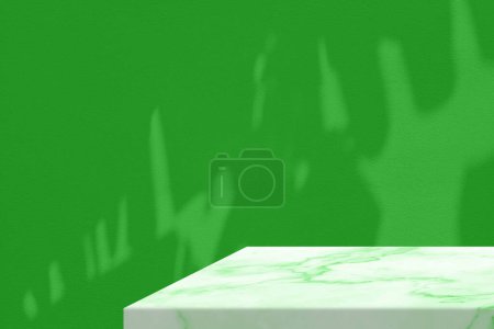 Photo for Minimal Marble Table Corner with Banana Leaves Shadow on Green Concrete Wall Background, Suitable for Product Presentation Backdrop, Display, and Mock up. - Royalty Free Image