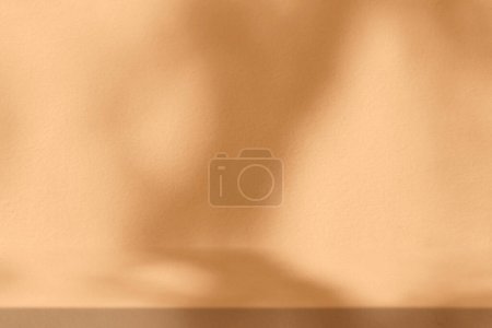 Photo for Dark Gold Stucco Table with Nature Shadow on Concrete Wall Texture Background, Suitable for Cosmetic Product Presentation Backdrop, Display, and Mock up. - Royalty Free Image