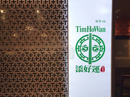 Photo for BANGKOK, THAILAND - DECEMBER 28, 2023: TimHoWan sign. It is a Hong Kong dim sum restaurant chain originating from Hong Kong, was founded in March 2009. - Royalty Free Image