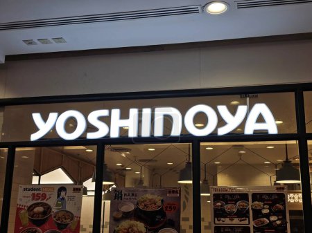 Photo for BANGKOK, THAILAND - JANUARY 17, 2024: Yoshinoya sign. It is a famous Japanese multinational fast food chain, was founded in 1899. - Royalty Free Image