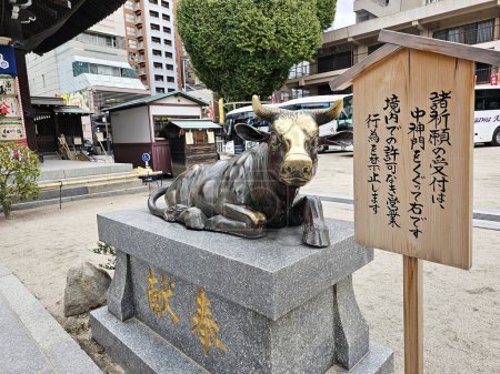 Photo for Fukuoka, Japan - November 13, 2023: Statue of a Cow at Kushida Jinja shrine where is a Shinto shrine located in Hakata-ku, Fukuoka, Japan, was founded in in 757. - Royalty Free Image