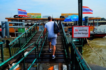 Photo for BANGKOK, THAILAND - NOVEMBER 07, 2017: Traveler walking to ferry from Wat Arun Temple cross river ferry pier. Travelers use this pier to Wat Pho Temple. - Royalty Free Image
