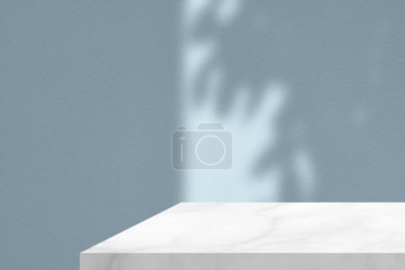 Photo for White Marble Table Corner with Light Beam, Shadow, and Spotlight on the Cyan Blue Concrete Wall Background, Suitable for Product Presentation Backdrop, Display, and Mock up. - Royalty Free Image