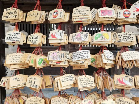 Photo for Fukuoka, Japan - November 13, 2023: Japanese wooden wishing boards ema at Kushida Jinja shrine where is a Shinto shrine located in Hakata-ku, Fukuoka, Japan, was founded in in 757. - Royalty Free Image