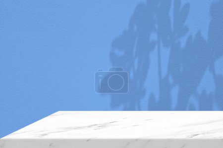 Photo for White Marble Table Corner with Light Beam, Shadow, and Spotlight on the Blue Concrete Wall Background, Suitable for Product Presentation Backdrop, Display, and Mock up. - Royalty Free Image