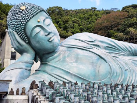 Photo for FUKUOKA, JAPAN - NOVEMBER 14, 2023: Close up Big Reclining buddha image at Nanzoin Temple where is landmark of Sasaguri, Fukuoka, Japan. - Royalty Free Image