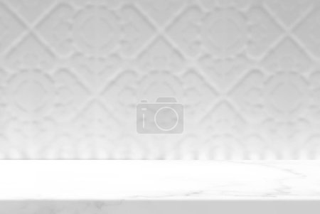 Foto de Marble Table with White Blurred Vintage Thai Sculpture Wall Background with Light Beam, Suitable for Product Presentation Backdrop, Display, and Mock up. - Imagen libre de derechos
