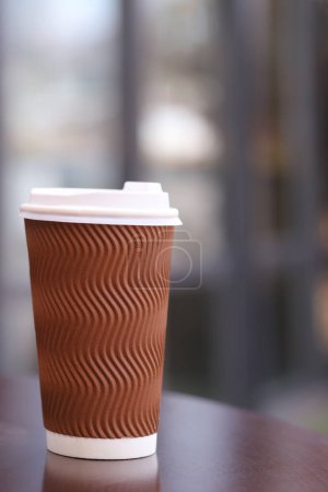Photo for Cup with coffee on the table, blurred background out of focus. Vertical Orientation - Royalty Free Image
