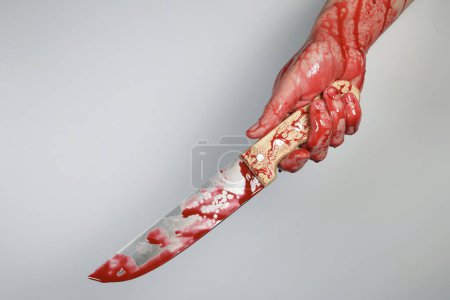 Photo for Bloody knife in hand, concept of violence, murder, killer - Royalty Free Image