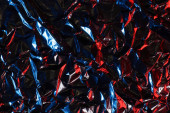crumpled aluminum foil in red and blue light, background or texture Poster #655264540