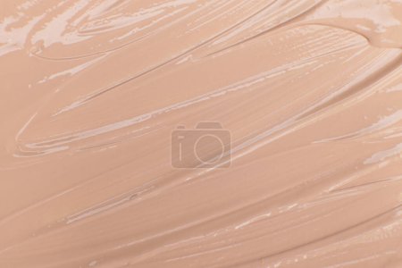 Photo for Beige cosmetic foundation cream background, texture - Royalty Free Image