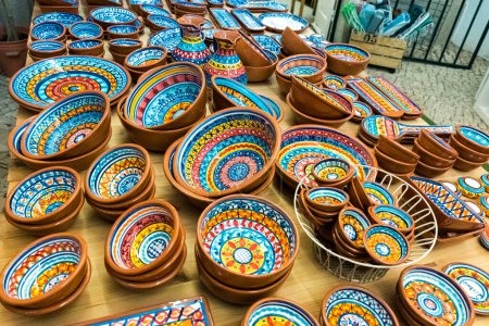 Photo for Collection of colorful pottery from a local craft store on display. Handmade ceramic gift shop in Lisbon, Portugal - Royalty Free Image