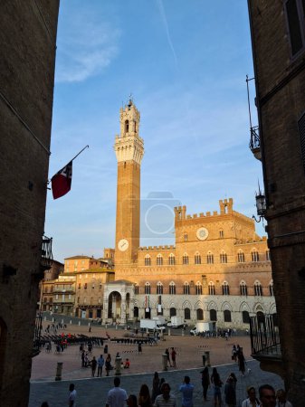 Photo for Piazza del Campo is the shell-shaped square where the Palio di Siena takes place. The Palazzo Pubblico and the Torre del Mangia dominate the square towards the Duomo. - Royalty Free Image