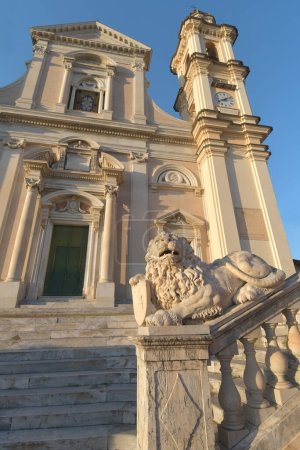 Photo for The Basilica of Santo Stefano a Lavagna is a masterpiece of marble, balustrades, stairways, churchyards and lions among the colorful gloomy houses of Piazza Marconi - Royalty Free Image