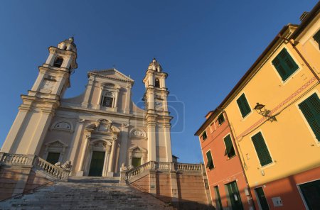 Photo for The Basilica of Santo Stefano a Lavagna is a masterpiece of marble, balustrades, stairways, churchyards and lions among the colorful gloomy houses of Piazza Marconi - Royalty Free Image