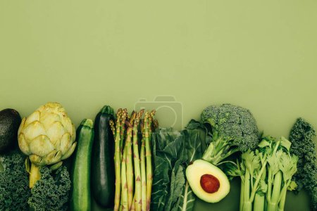 Photo for Organic healthy green vegetables on colorful background - Royalty Free Image